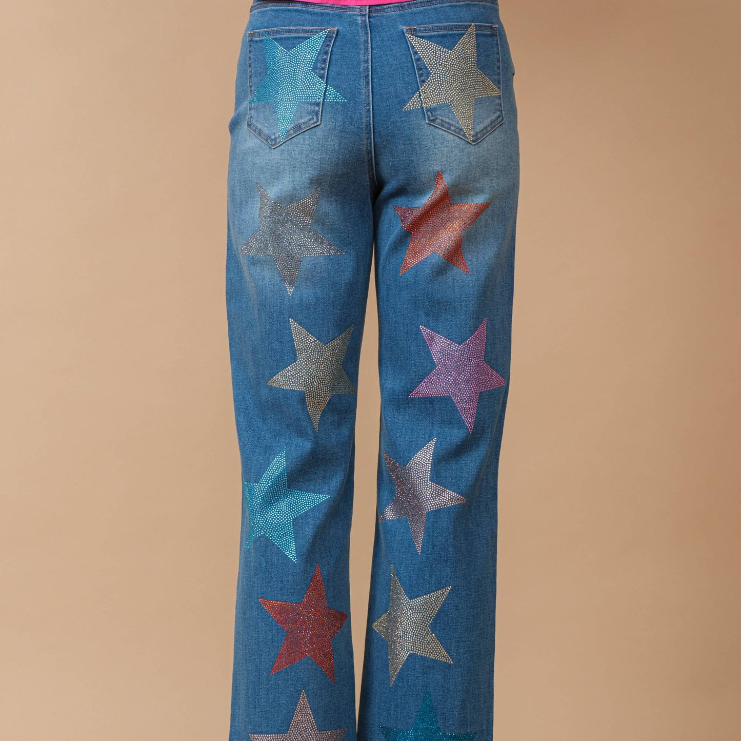 Back view of jeans with multi colored star shaped rhinestones