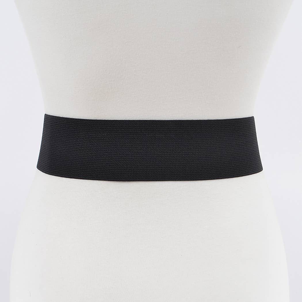 Back view of a black bow stretch belt on a mannequin