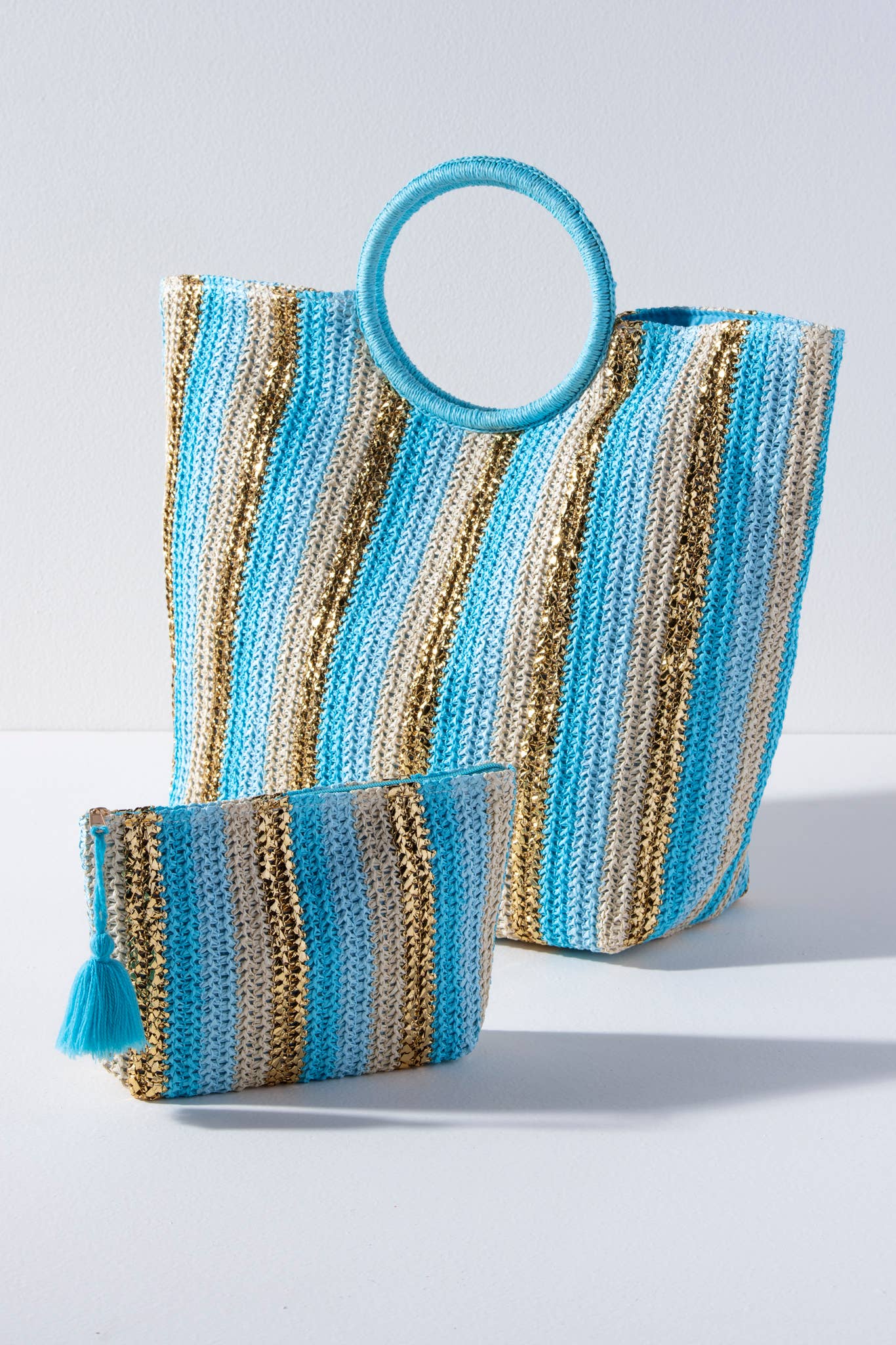 large tote bag nd small zip pouch with blue and gold metallic stripes