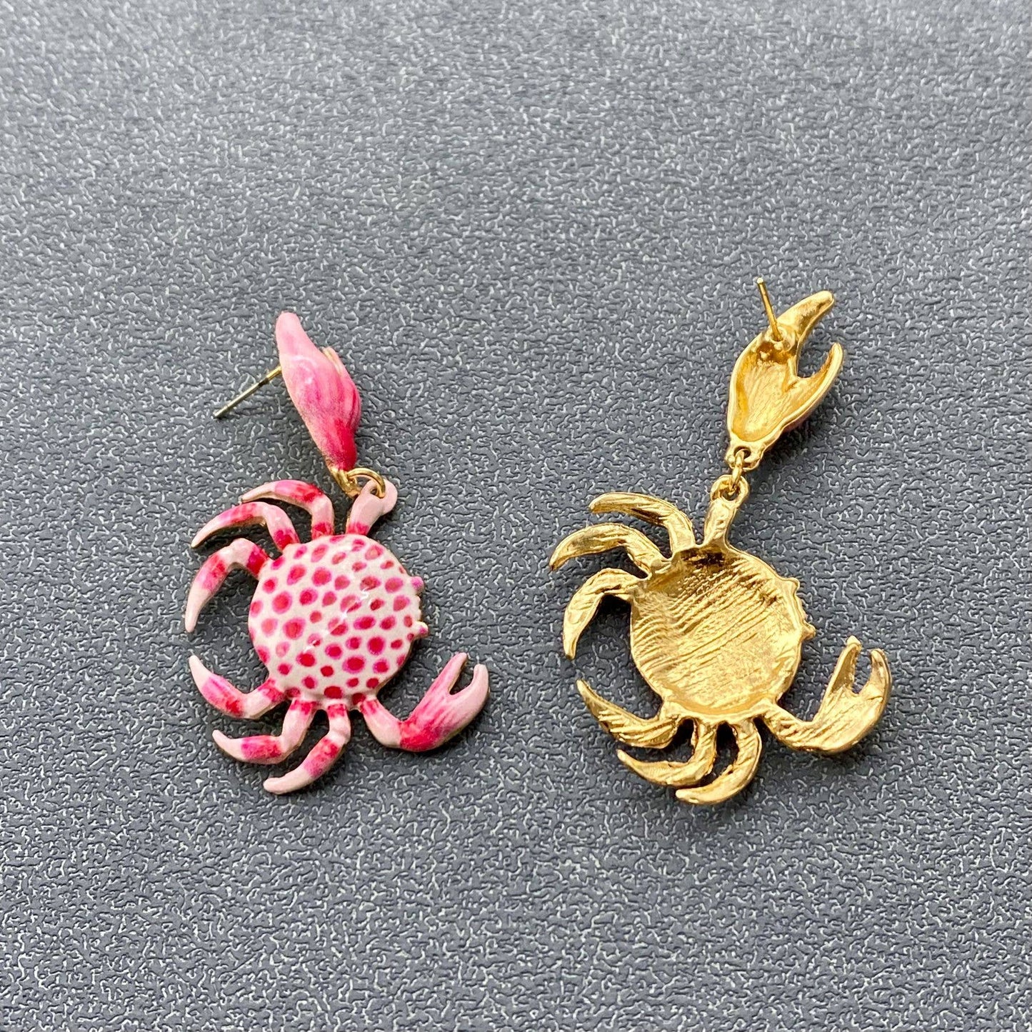 front and back view of pink and white enamal crab earrings