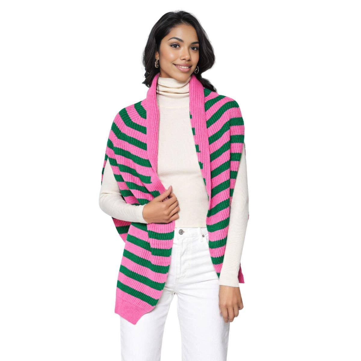 woman wearing pink and green stripe sweater scarf with white top and white jeans in front of a white background