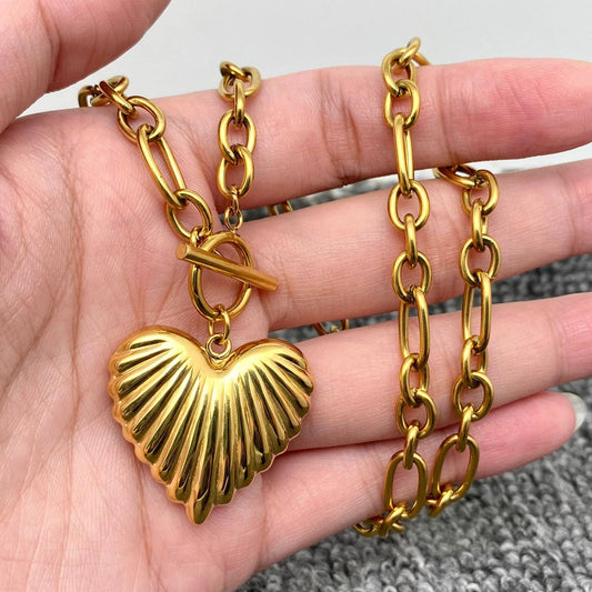 Gold puffy heart charm necklace