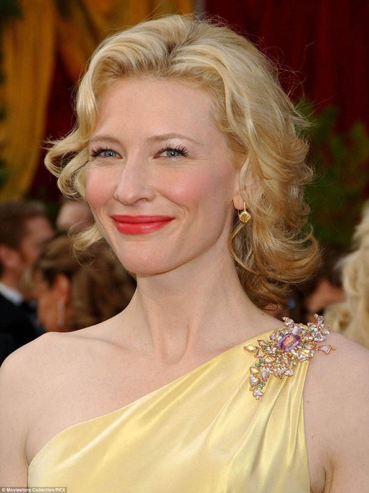 Cate Blanchett in a yellow dress and crystal brooch