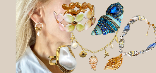 Coastal grandmother style including necklaces, earrings, a pearl ring, brooch, and bracelet from JuJu Loves