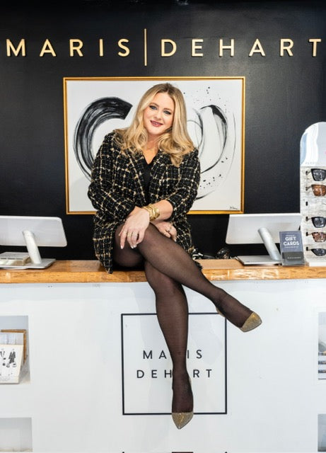 Where to shop JuJu Loves in Charleston: Alden DeHart Haviland sitting on the cash wrap desk of the Maris DeHart Boutique in Charleston, SC