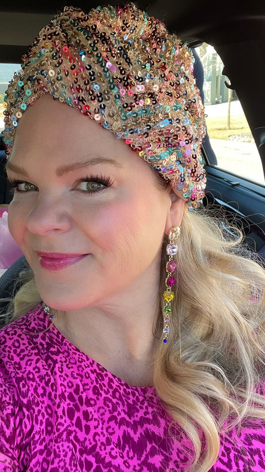 Best earrings for your face shape featuring rainbow crystal drop earrings on a woman