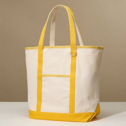 White tote bag with yellow accents on a beige background