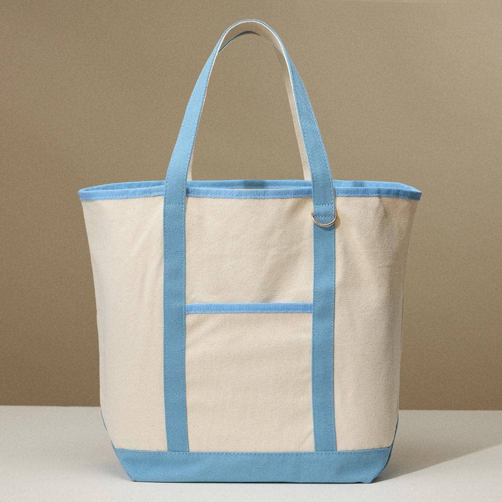 Beige canvas tote bag with light blue accents on a beige background
