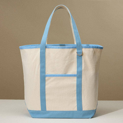 Beige canvas tote bag with light blue accents on a beige background