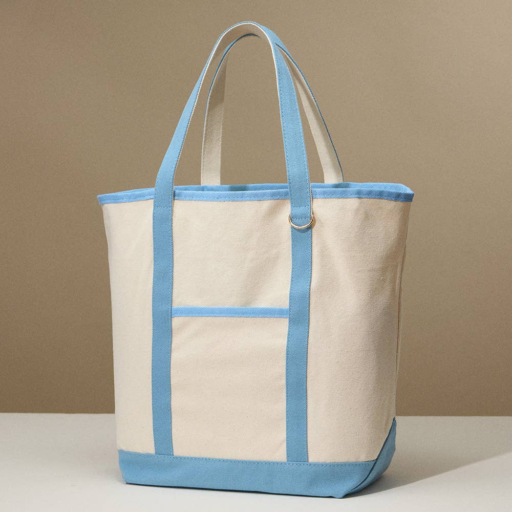 Beige canvas tote bag with light blue accents on a beige background