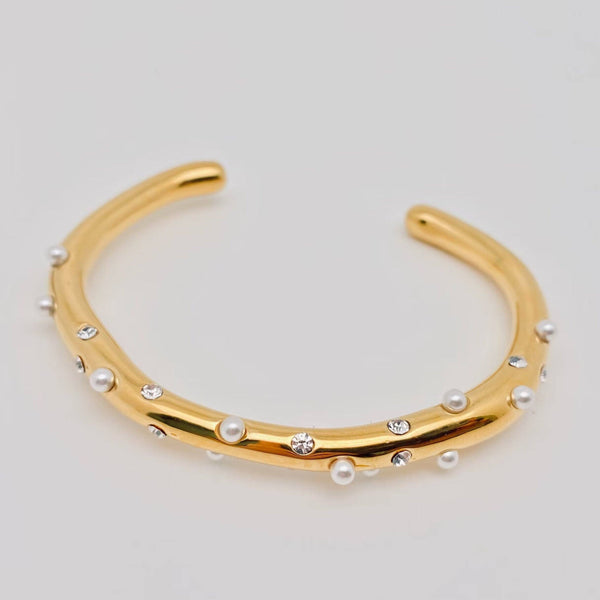 gold bangle bracelet adjustable with pearl and rhinestone detail