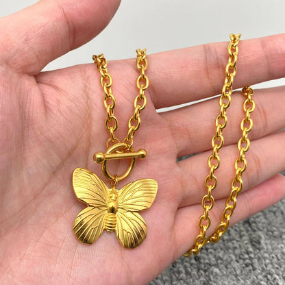 Gold chain toggle necklace with butterfly charm