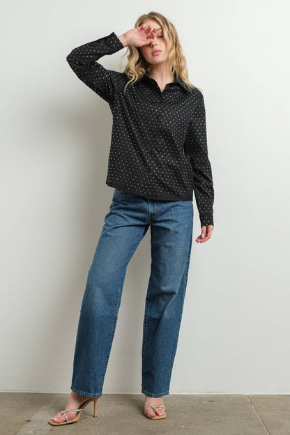 Black rhinestone embellished cotton blouse on woman with jeans