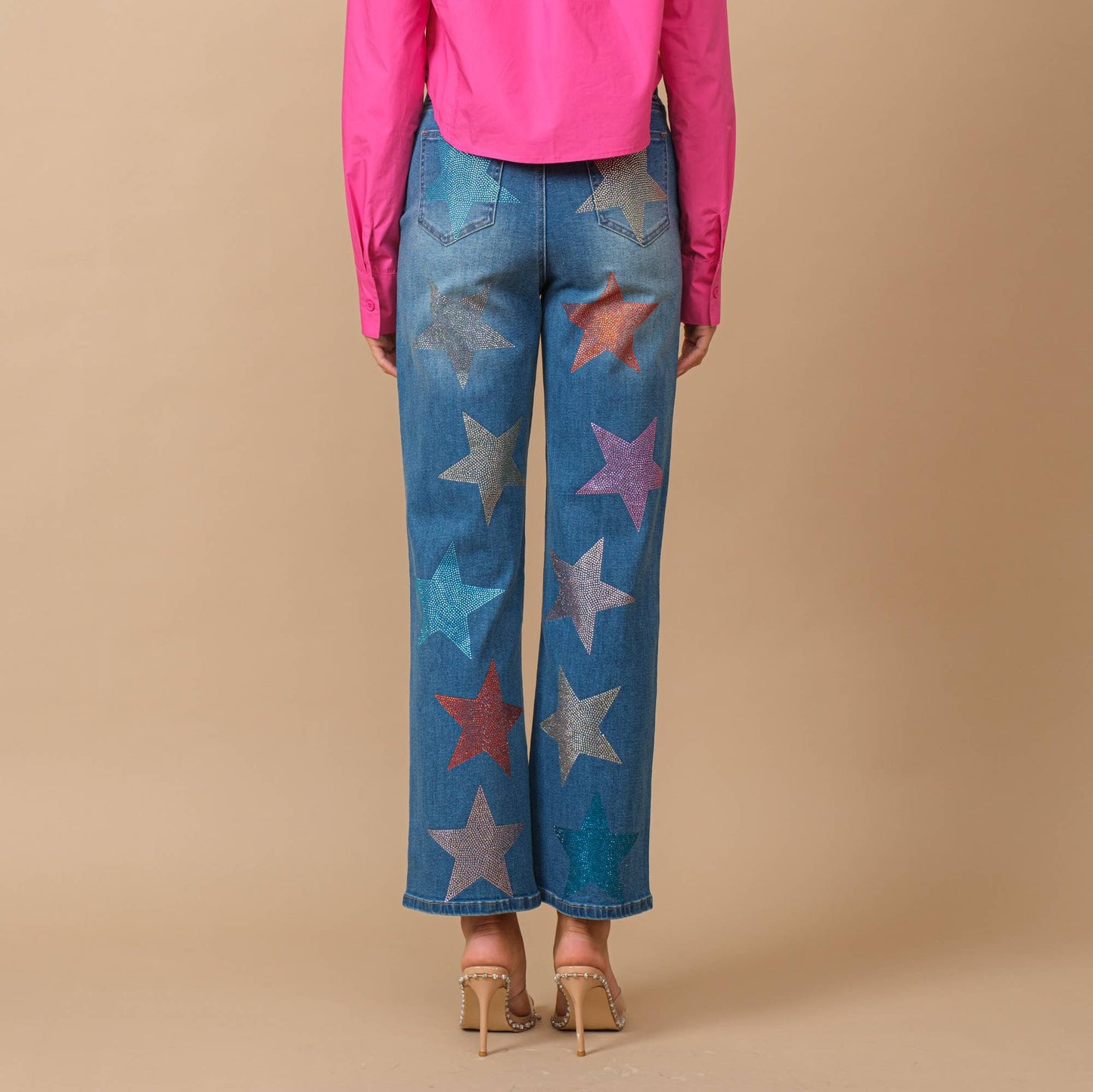 Back view of rhinestone embellished jeans with star shapes