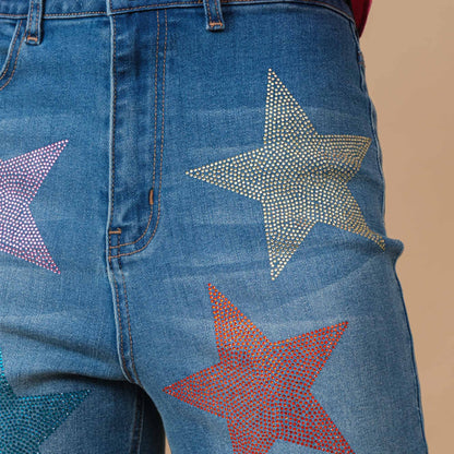 Up close detail of jeans pocket with star shaped rhinestone embellishment 