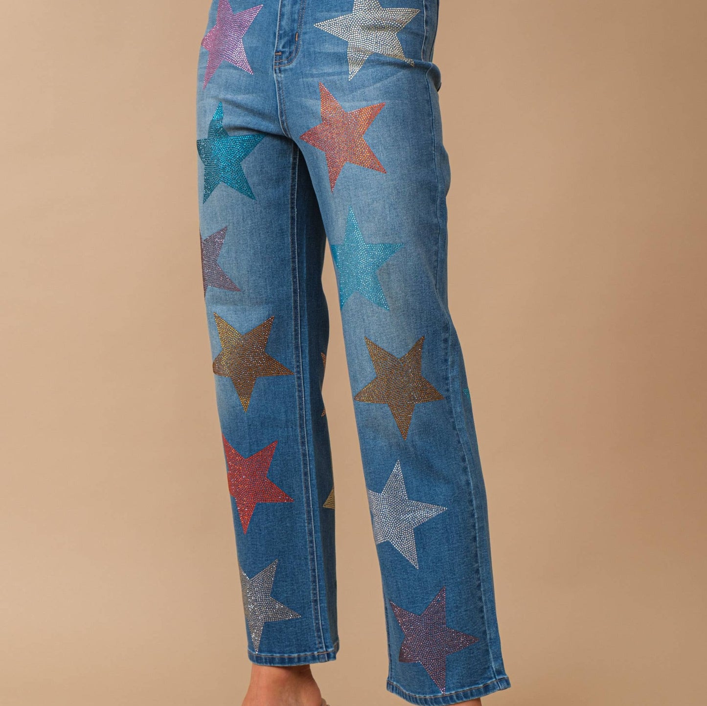 Jeans with multi colored star shaped rhinestone embellishment 