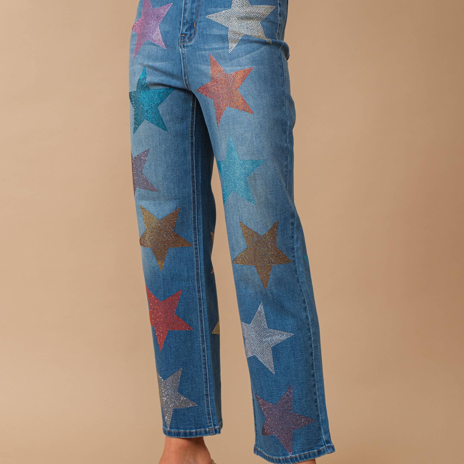 Jeans with multi colored star shaped rhinestone embellishment 
