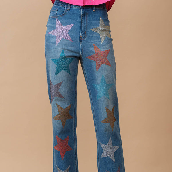 Rhinestone star embellished straight leg jeans with multicolor crystal stars on medium wash denim — front view