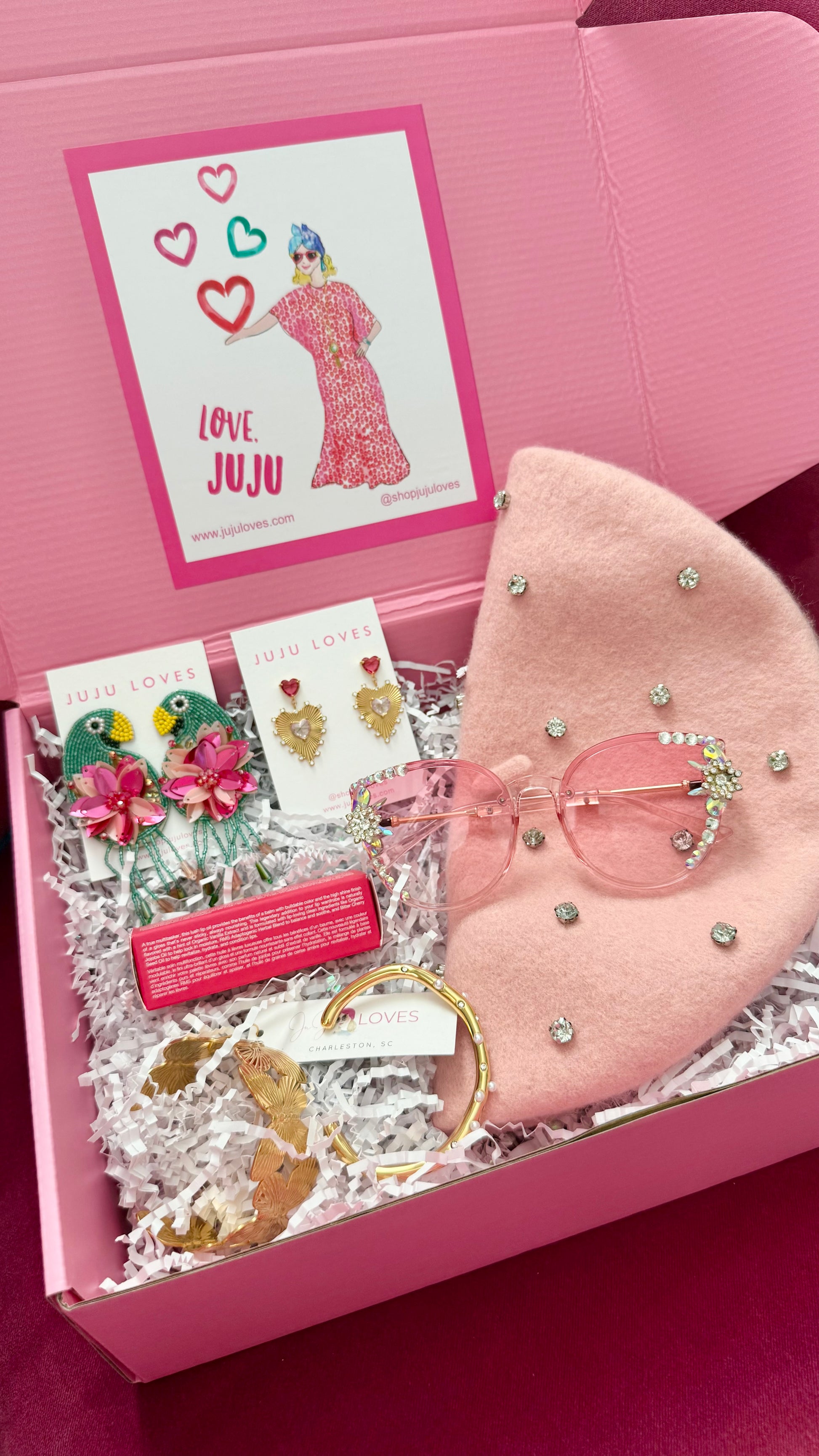 Pink decorative box with accessories in a box, featuring 'Love Juju' branding.