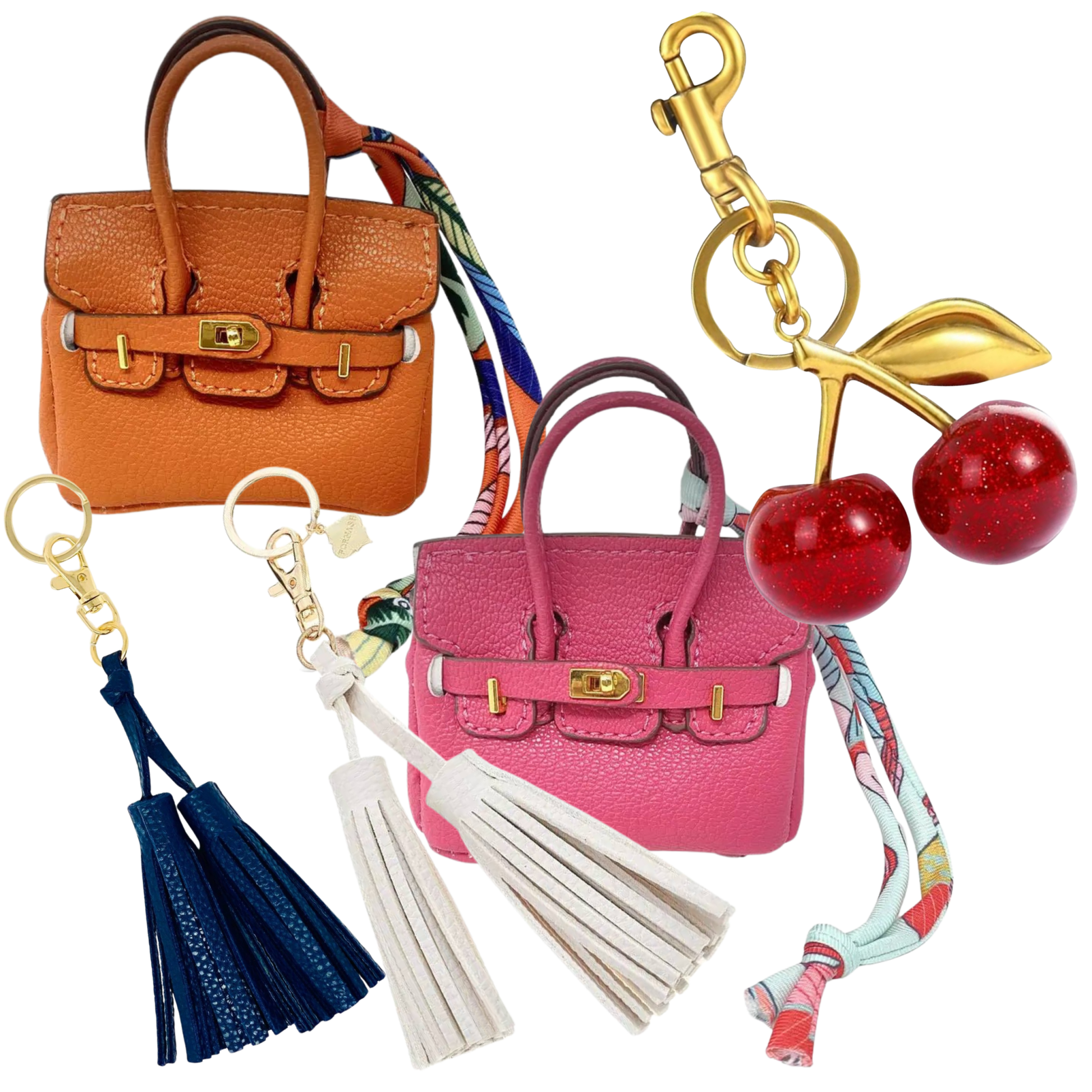 Collection of miniature handbag, cherry, and tassel bag charms on a white background