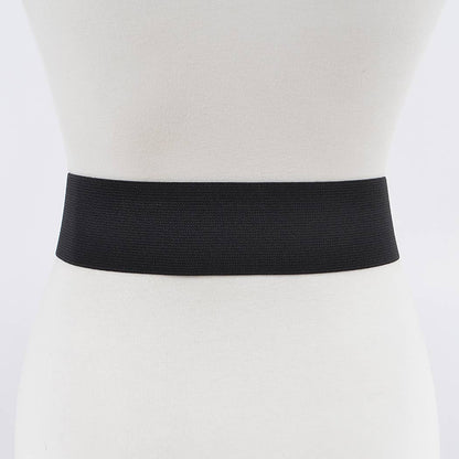 Back view of a black bow stretch belt on a mannequin
