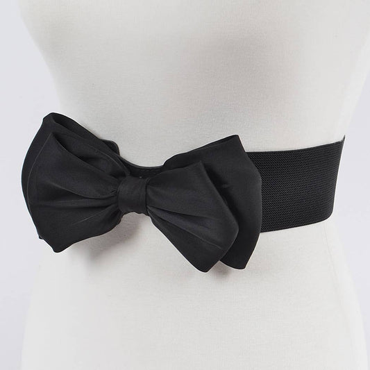 A black bow-tied belt on a mannequin waist.
