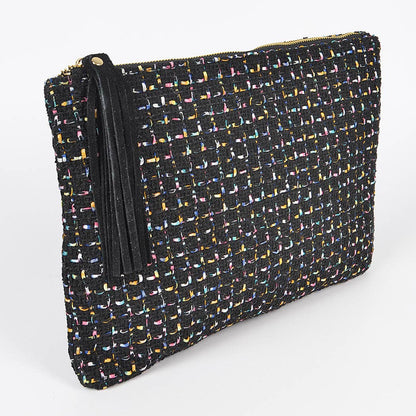 angled side view of black tweed pouch with black tassel against a white background