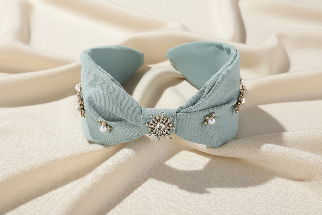 Light blue knotted headband with pearl and crystal embellishments from JuJu Loves