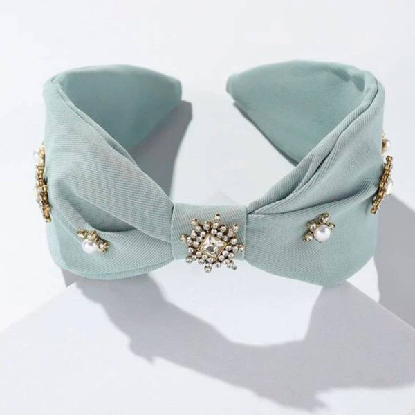 light blue knotted headband with pearl and crystal embellishments