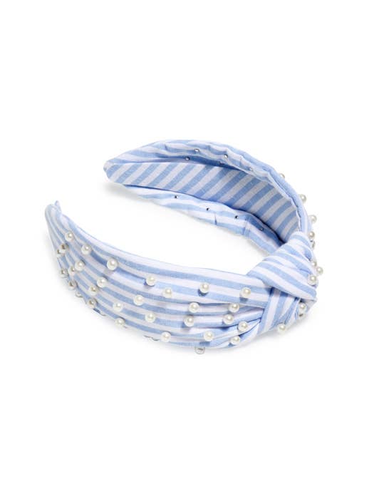 Blue and white striped headband with pearl embellishments on a white background