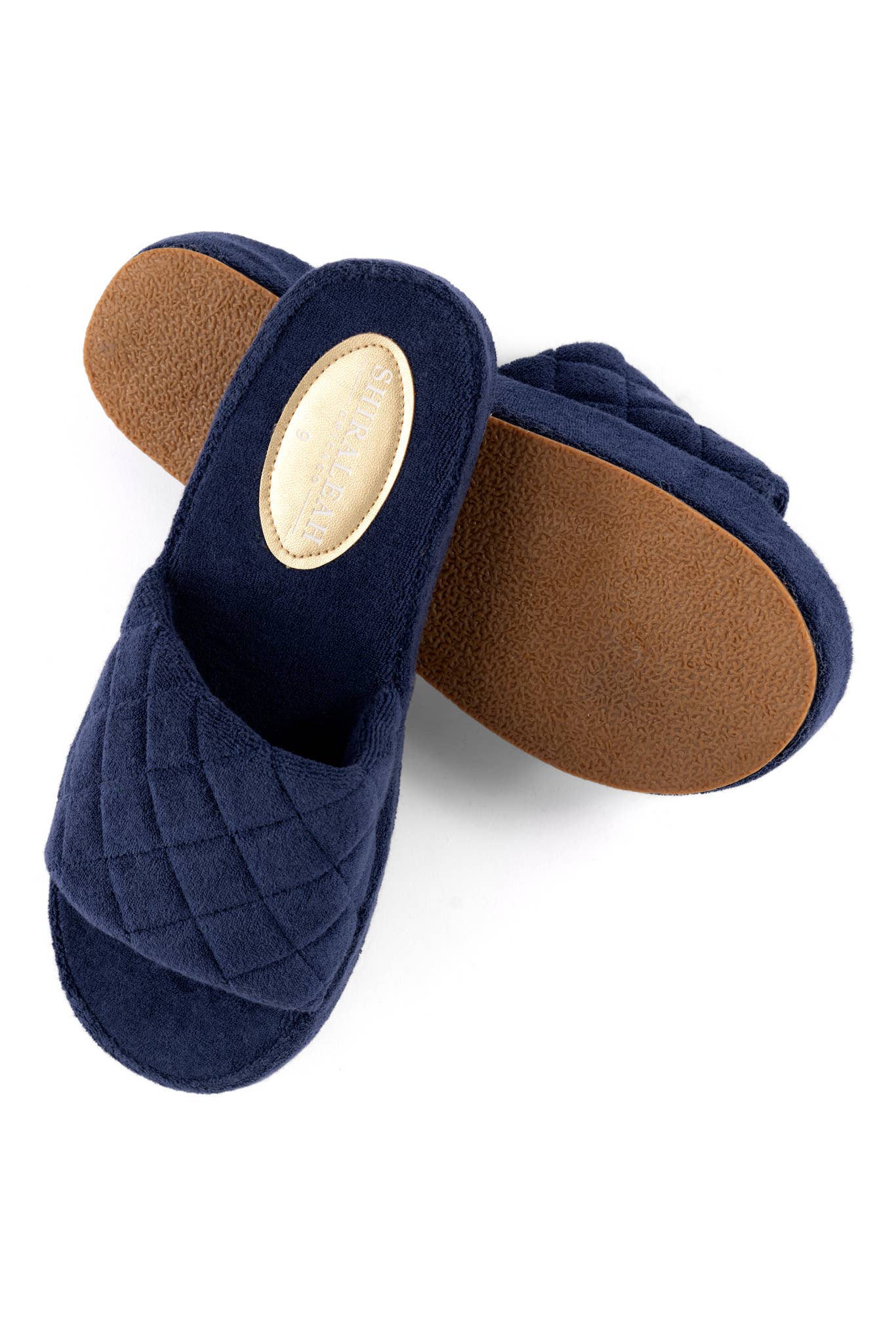 blue terry pool slides angles to show the bottom sole and top fabric against a white background