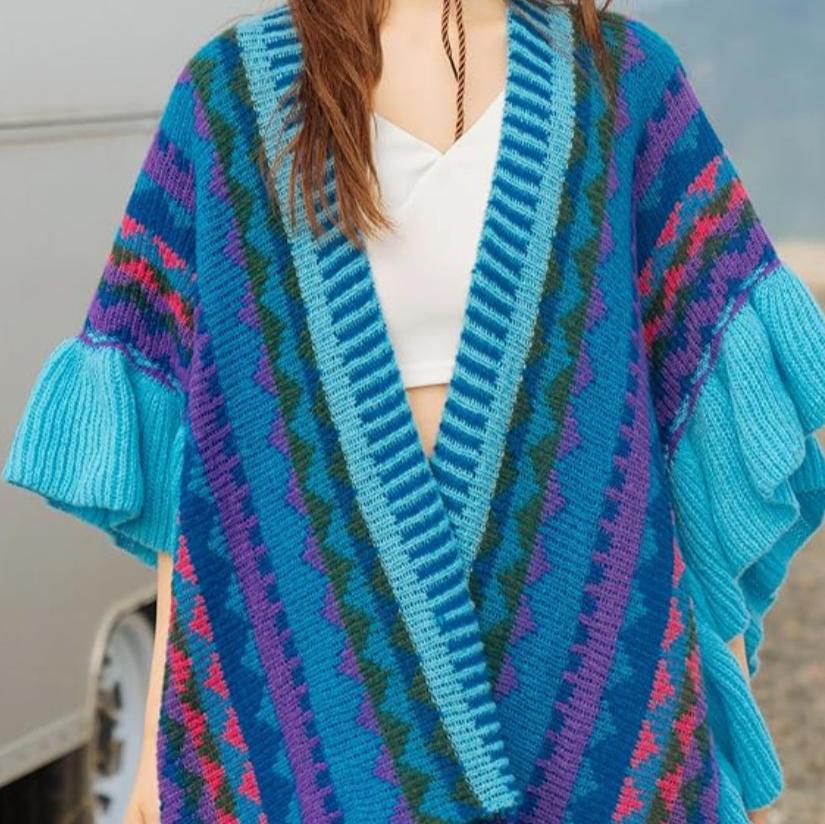 woman in white tank to wearing blue multi colored wrap
