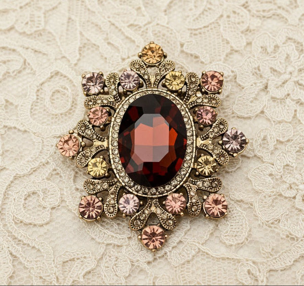 Cognac crystal starburst brooch with amber and rose rhinestones in gold filigree setting by JuJu Loves