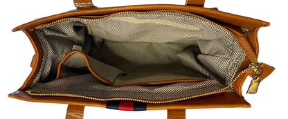 Striped vegan leather tote bag showing tote handles and interior pockets