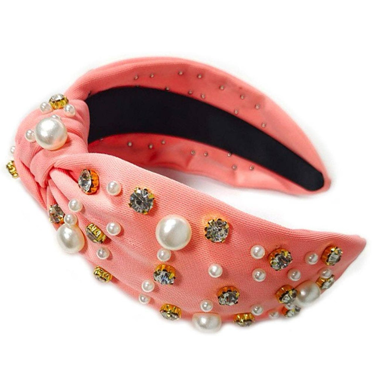 coral fabric headband with crystal and faux pearl embellishment against a white background