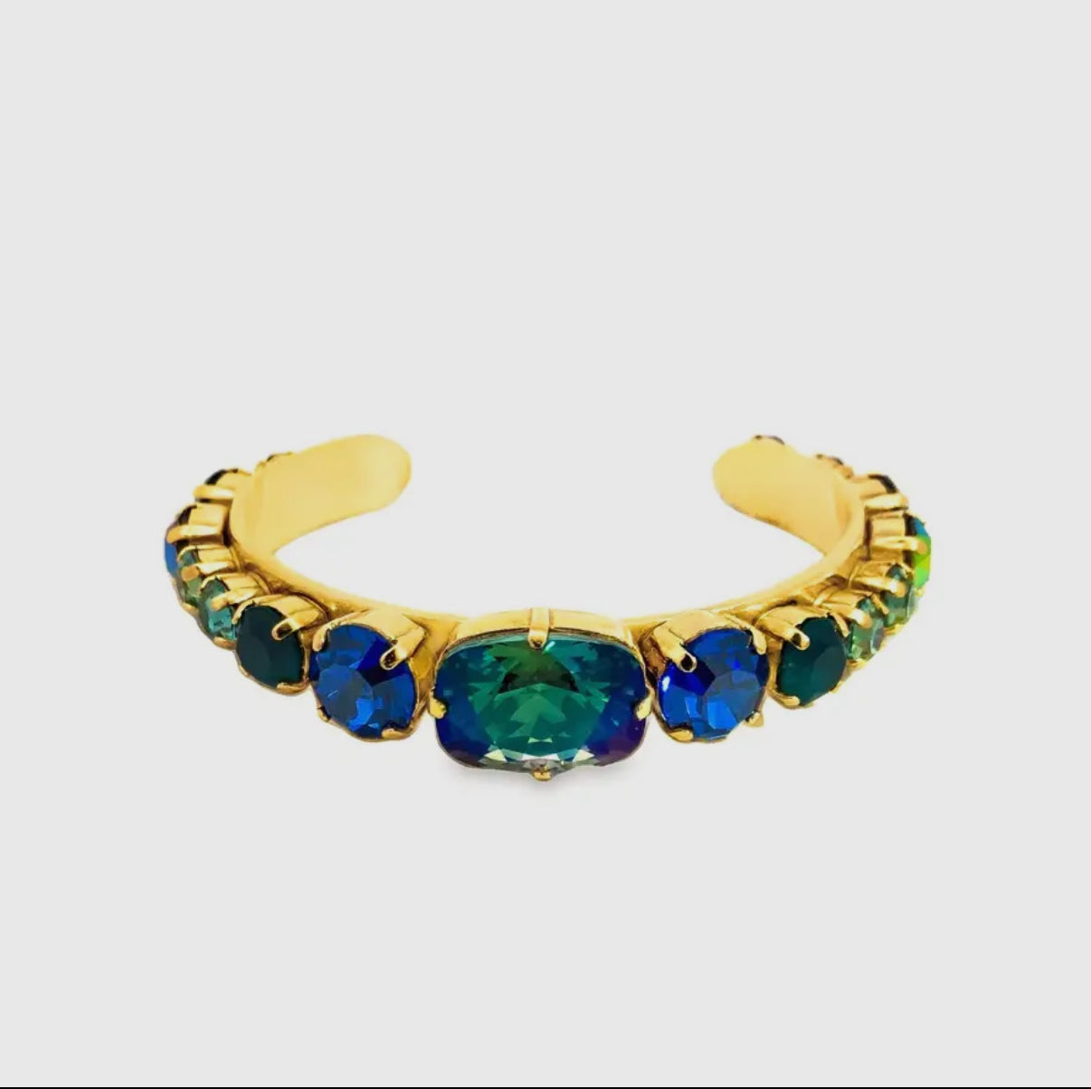 Aqua verde crystal cuff bracelet with iridescent blue-green stones in antique gold setting