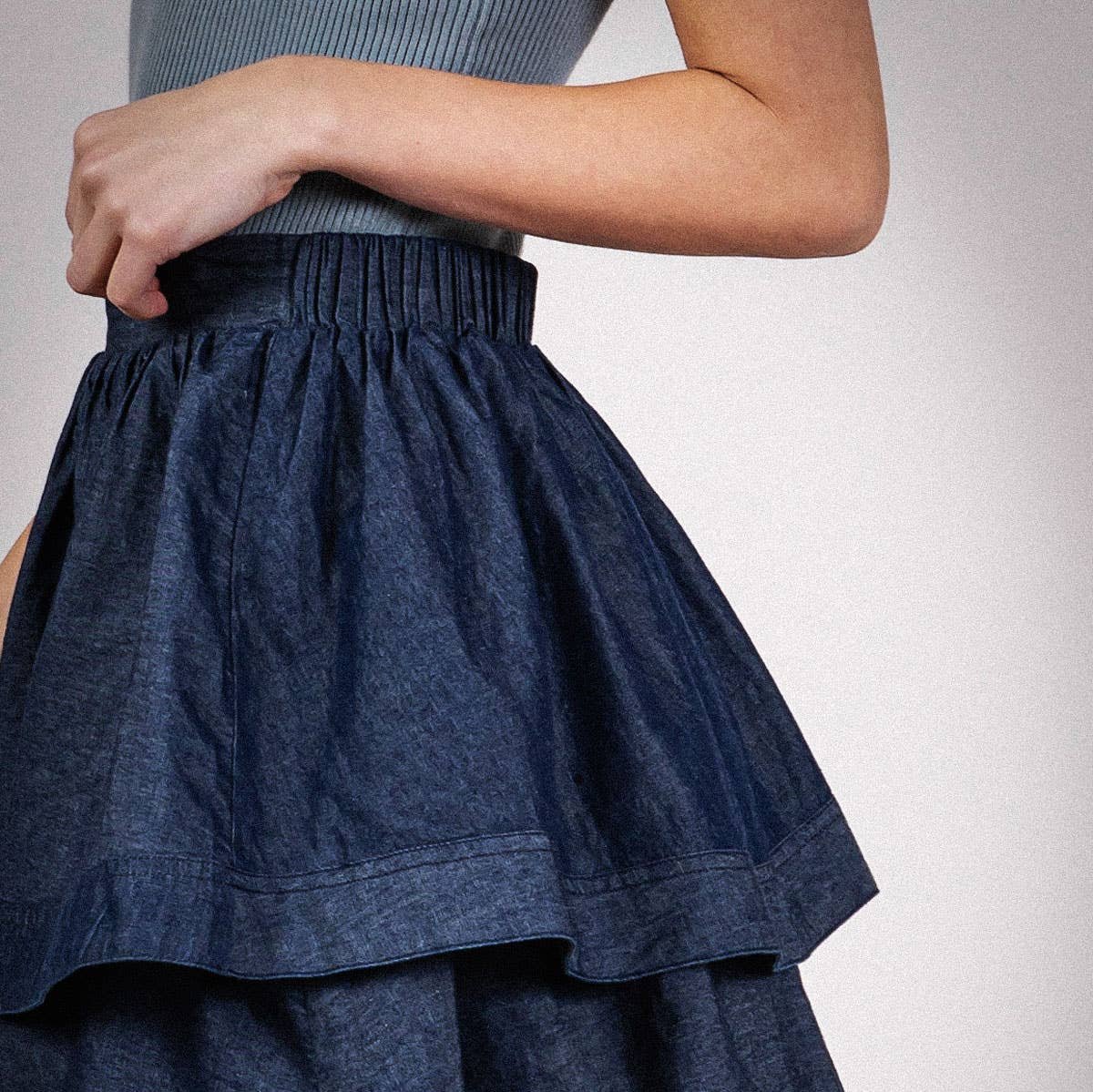 woman wearing denim tiered midi skirt 
