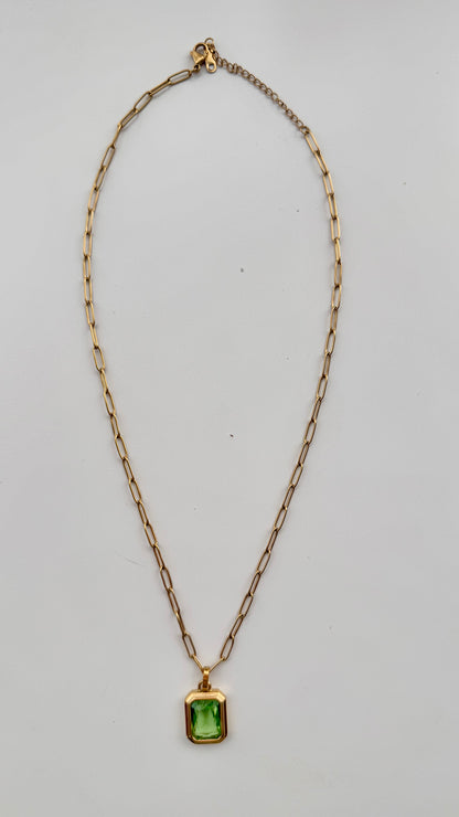 Green pendant necklace showing adjustable gold chain