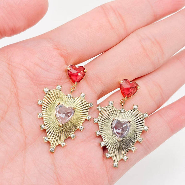 Gold heart dangle earrings with red crystal accents — lightweight statement earrings