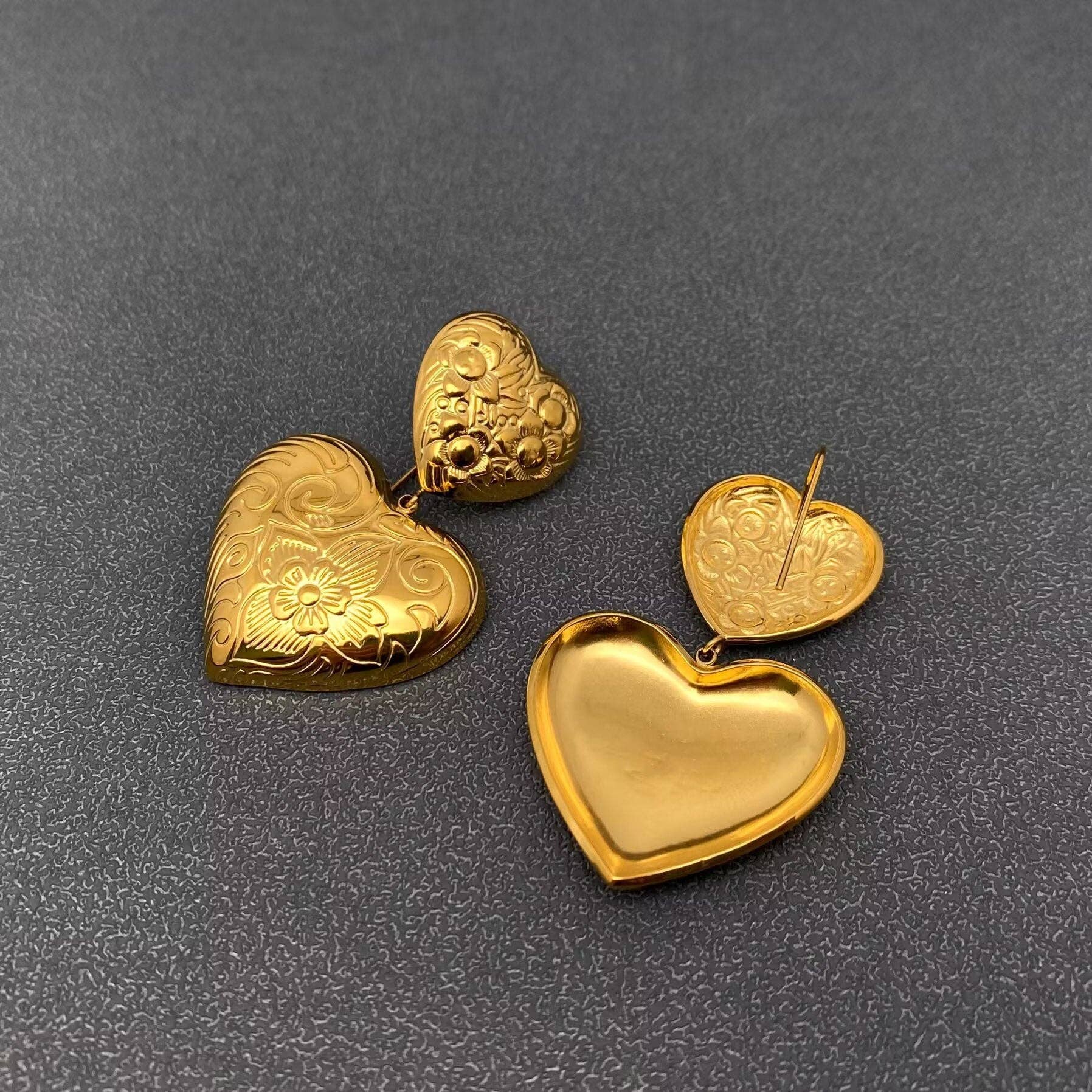 front and back view of pair of gold embossed double heart earrings