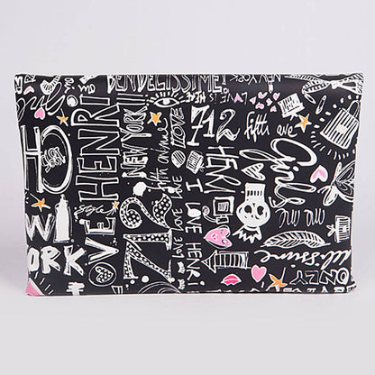 Graffiti print envelope clutch  — back view showing colorful doodle print on black background