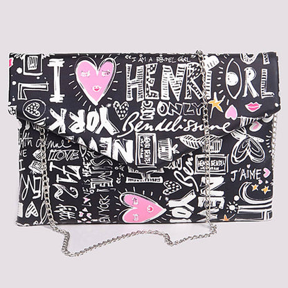 Graffiti print envelope clutch with chain strap — front view showing colorful doodle print on black background