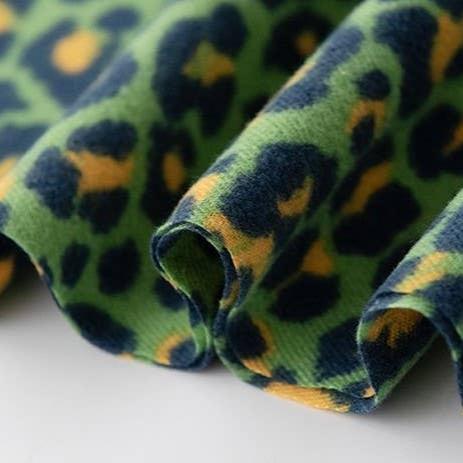 up close detail of green leopard print scarf
