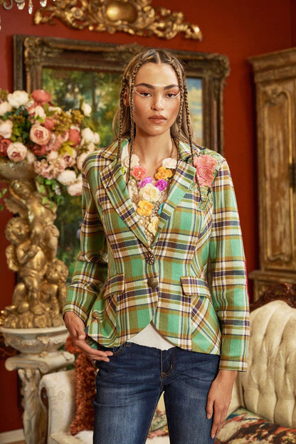woman wearing green plaid blazer and jeans