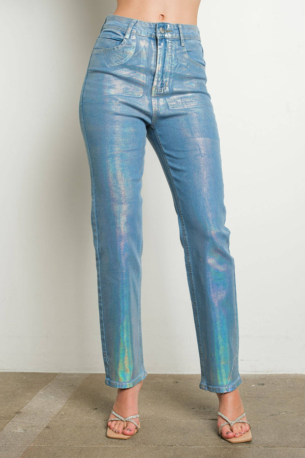 Iridescent metallic stretch denim jeans showing blue-green-pink holographic shimmer — front view on model