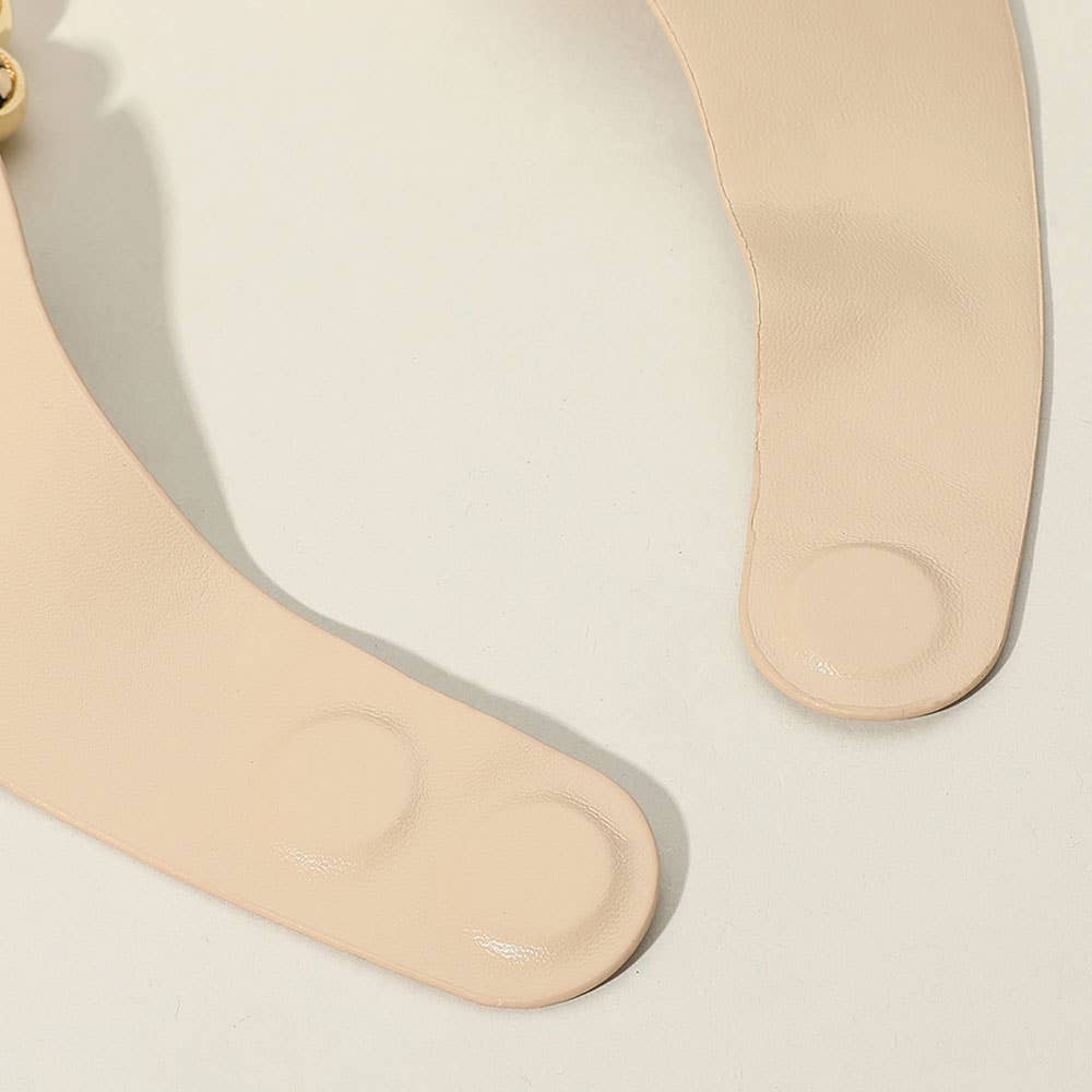 up close view of magnetic closure on beaded necklace against an ivory background