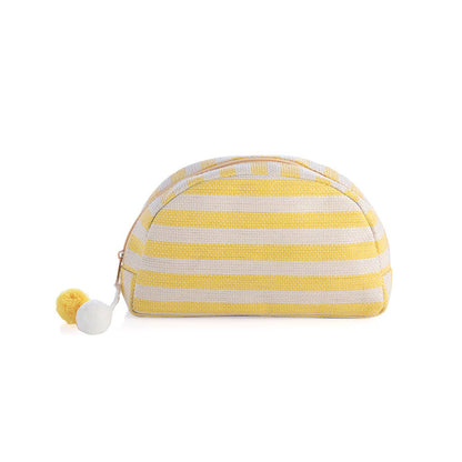 A lemon stripe patterned cosmetic or toiletry bag with a zipper and a pompon detail on a white background