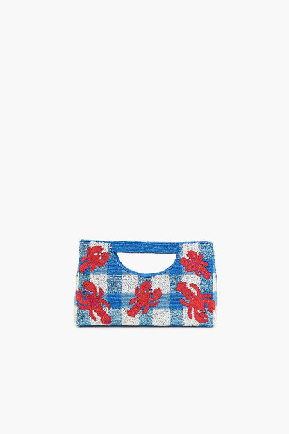 red sequin lobsters on a blue and white beaded bag against a white background
