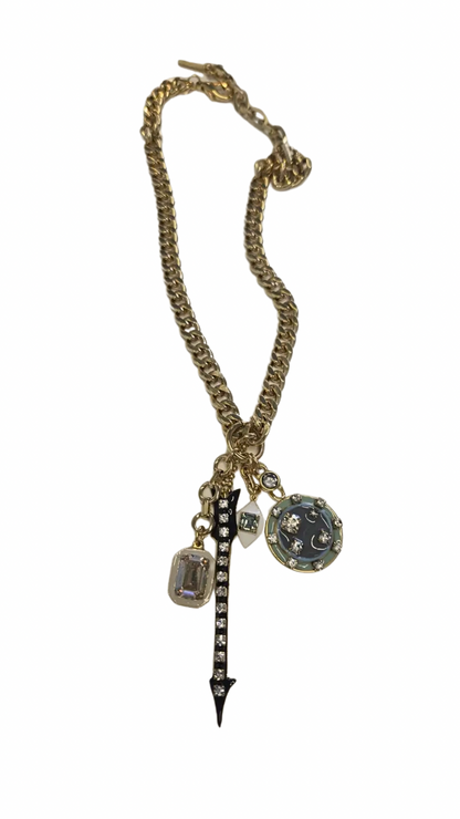 Necklace with arrow and multi charms on a white background