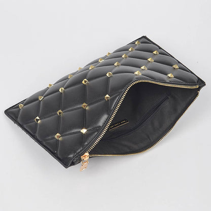 Black studded quilted pouch showing gold pyramid stud detail and quilted texture - open to show interior pocket